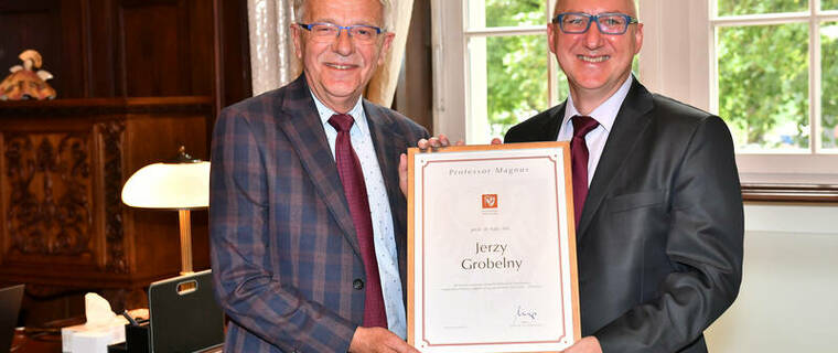 Professor Jerzy Grobelny with the title of 